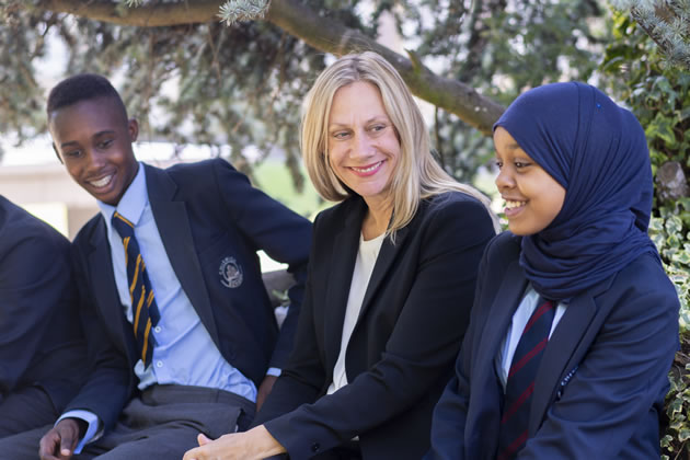 Headteacher Laura Ellener (centre) with pupils