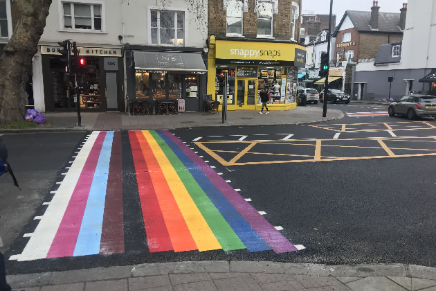 The crossing has the colours from the Progressive Pride Flag